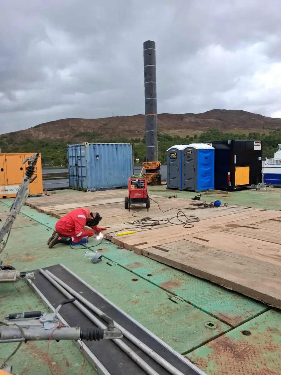 Welder working on decking on a jack-up platform